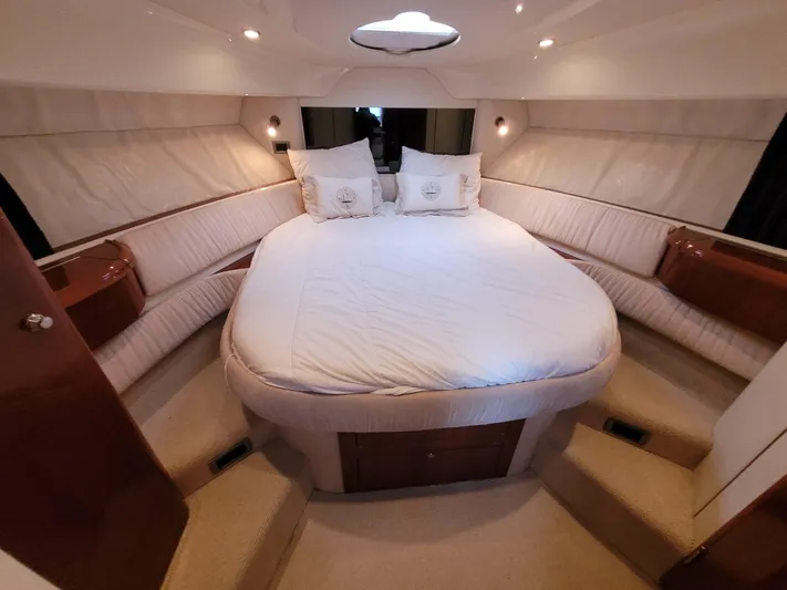 Rmvca Yacht Photos Pics Luxurious cabin interior of 2004 Fairline Targa 43 yacht with plush bedding and ambient lighting.