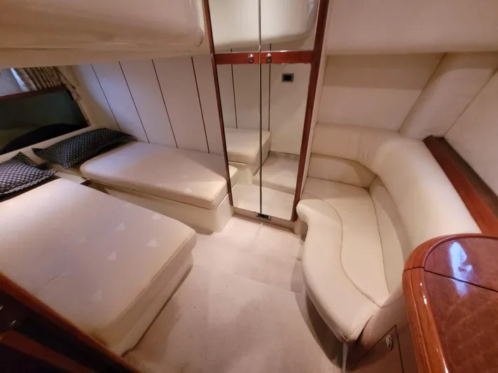 Rmvca Yacht Photos Pics 2004 Fairline Targa 43 yacht interior with cozy seating and mirrored storage.