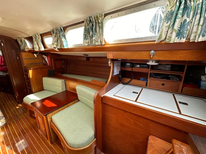  Yacht Photos Pics Interior of 1978 Hinckley Bermuda 40 MK III sailboat with wood finish and seating area.