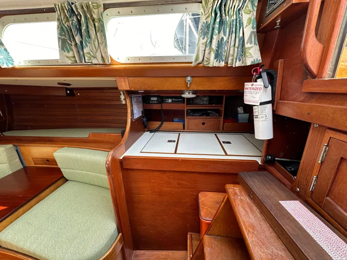  Yacht Photos Pics Interior of 1978 Hinckley Bermuda 40 MK III sailboat with wood finish and seating area.