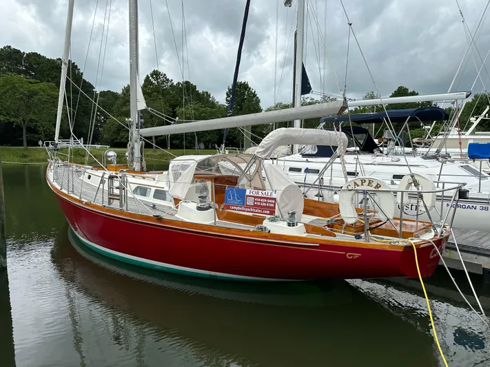  Yacht Photos Pics 1978 Hinckley Bermuda 40 MK III sailboat with red hull, docked and for sale.
