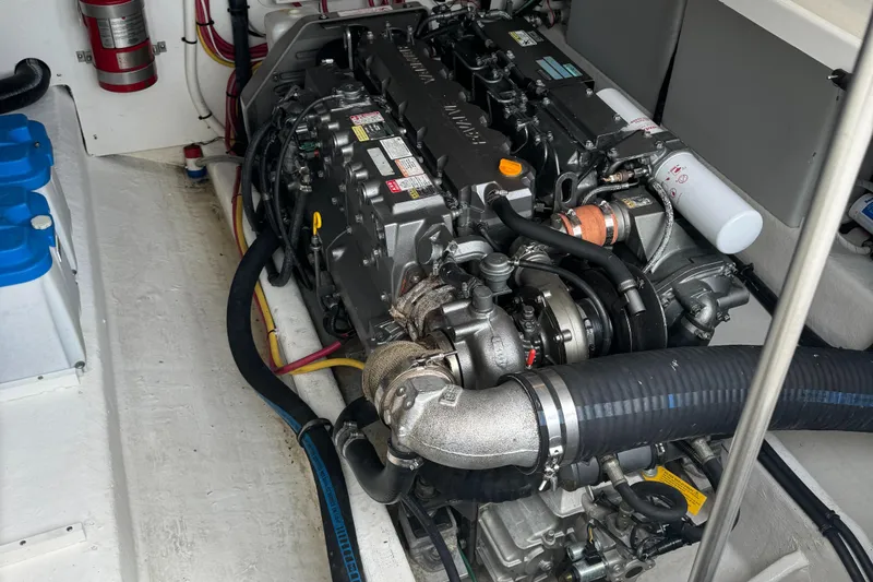 "flying Low" Yacht Photos Pics Engine compartment of a 2008 Back Cove 33 boat, showcasing detailed mechanical components.