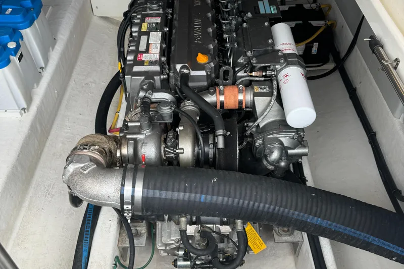 "flying Low" Yacht Photos Pics Engine compartment of a 2008 Back Cove 33 boat, showcasing detailed mechanical components.