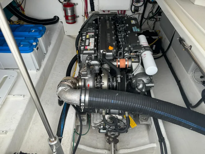 "flying Low" Yacht Photos Pics Engine compartment of a 2008 Back Cove 33 boat, showcasing detailed mechanical components.