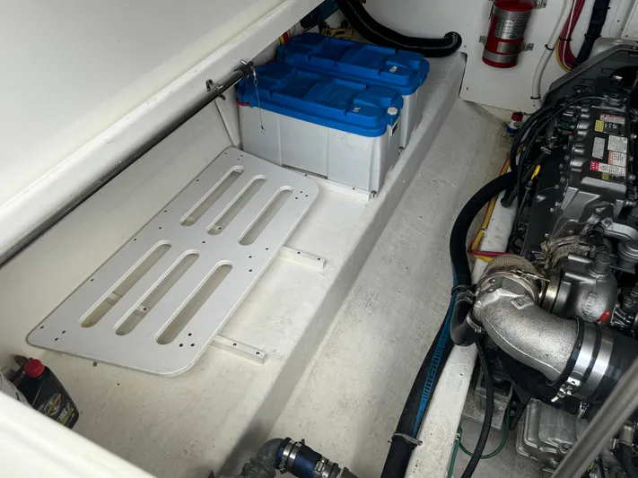 "flying Low" Yacht Photos Pics Engine compartment of a 2008 Back Cove 33 boat, featuring batteries and mechanical components.