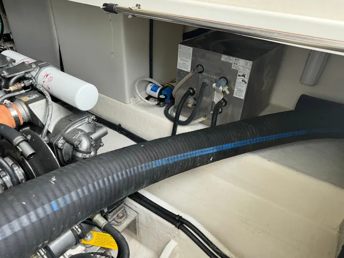 "flying Low" Yacht Photos Pics Engine compartment of a 2008 Back Cove 33 boat, featuring hoses and mechanical components.