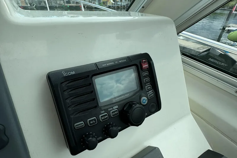 "flying Low" Yacht Photos Pics 2008 Back Cove 33 boat radio system with control panel, dockside view.