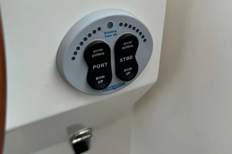 "flying Low" Yacht Photos Pics Control panel on a 2008 Back Cove 33 boat, featuring bow adjustment buttons.