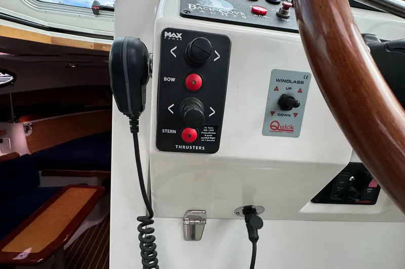 "flying Low" Yacht Photos Pics 2008 Back Cove 33 boat helm with thruster controls and steering wheel.