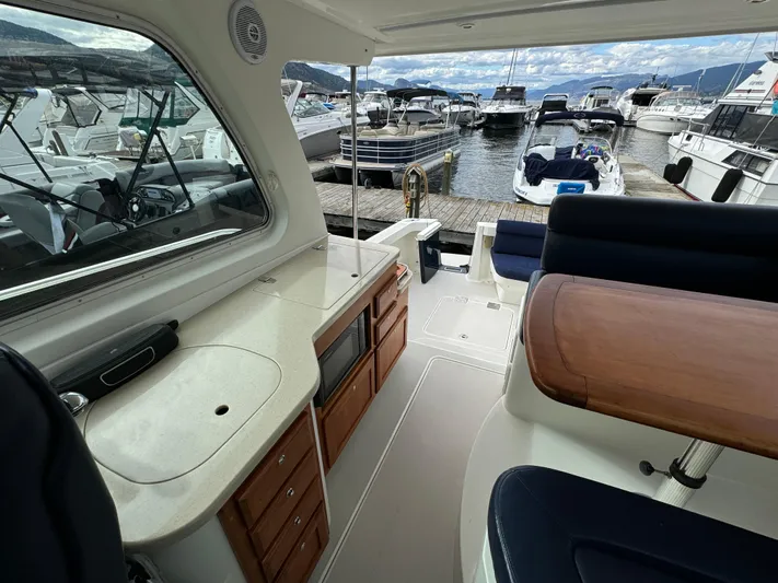 "flying Low" Yacht Photos Pics Interior view of a 2008 Back Cove 33 yacht docked at a marina.