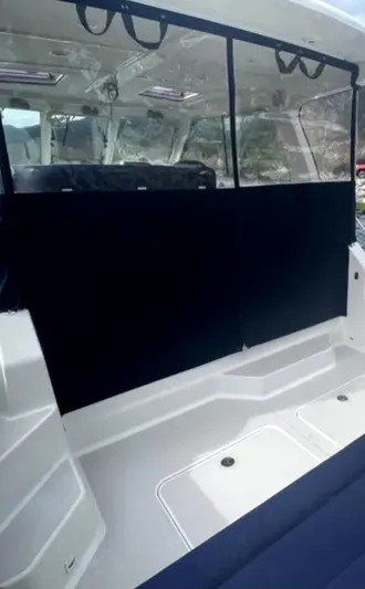 "flying Low" Yacht Photos Pics 2008 Back Cove 33 boat interior with seating and windows.