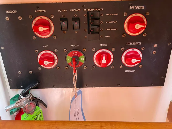 "flying Low" Yacht Photos Pics Control panel of a 2008 Back Cove 33 boat with switches and fire extinguisher.