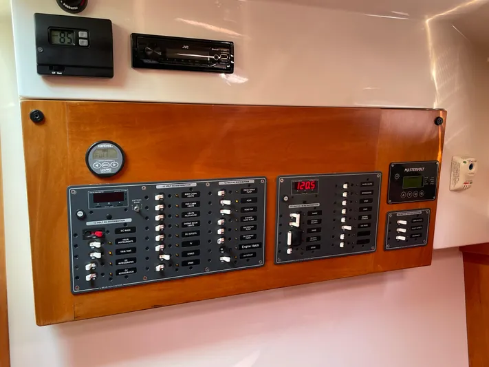 "flying Low" Yacht Photos Pics Electrical control panel on a 2008 Back Cove 33 boat, featuring various switches and displays.