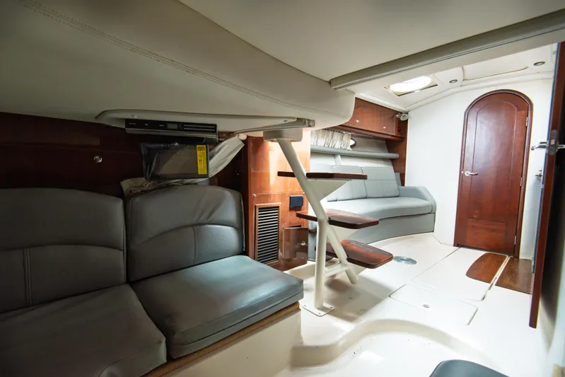  Yacht Photos Pics Interior of 2014 Four Winns V375 yacht with modern seating and wooden accents.