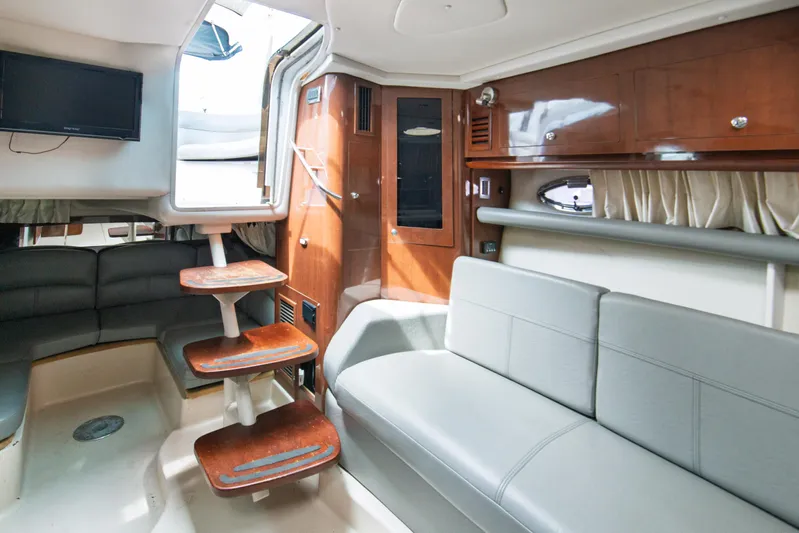  Yacht Photos Pics Interior of 2014 Four Winns V375 yacht with modern seating and wooden accents.