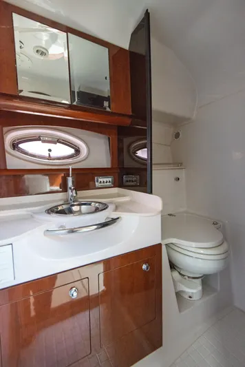 Yacht Photos Pics 2014 Four Winns V375 yacht bathroom with sink, mirror, and toilet.