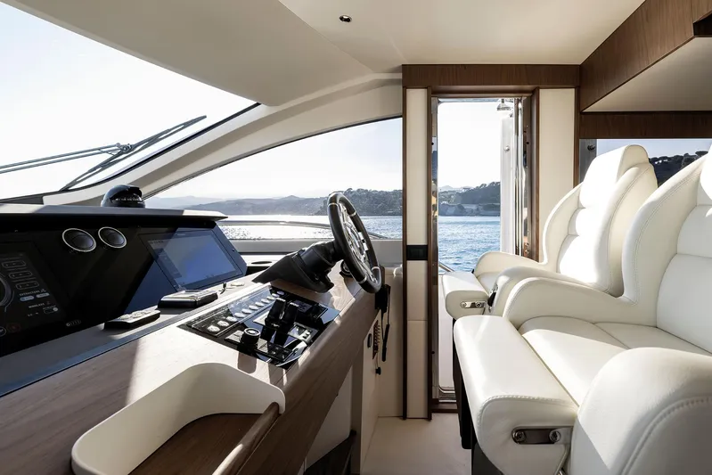  Yacht Photos Pics Luxurious interior of 2025 Azimut Fly 72 yacht with modern helm and plush seating.