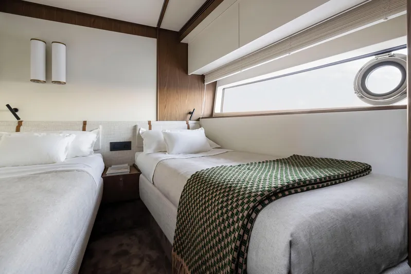  Yacht Photos Pics Luxurious twin bedroom in 2025 Azimut Fly 72 yacht, featuring modern design and elegant decor.
