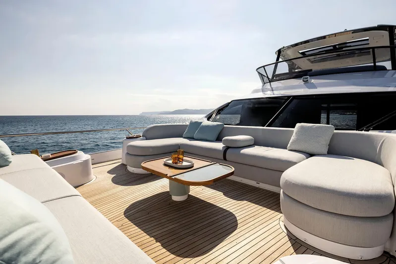  Yacht Photos Pics Luxurious 2025 Azimut Fly 72 yacht deck with elegant seating and ocean view.