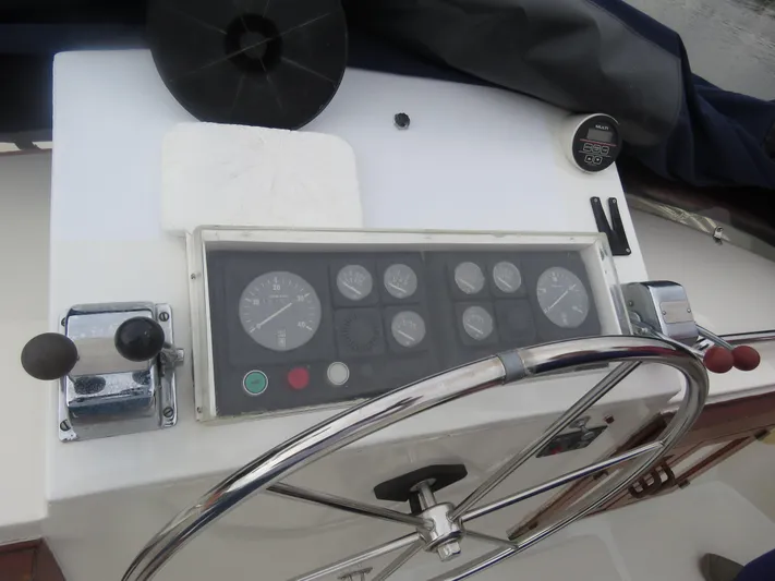 Patient Lady Yacht Photos Pics 1987 DeFever 49 Pilothouse helm with instrument panel.