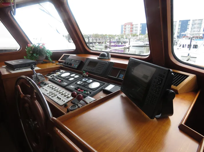 Patient Lady Yacht Photos Pics 1987 DeFever 49 Pilothouse helm with navigation instruments.