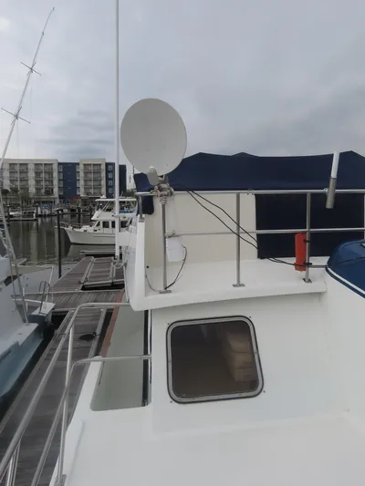 Patient Lady Yacht Photos Pics 1987 DeFever 49 Pilothouse docked, side view.