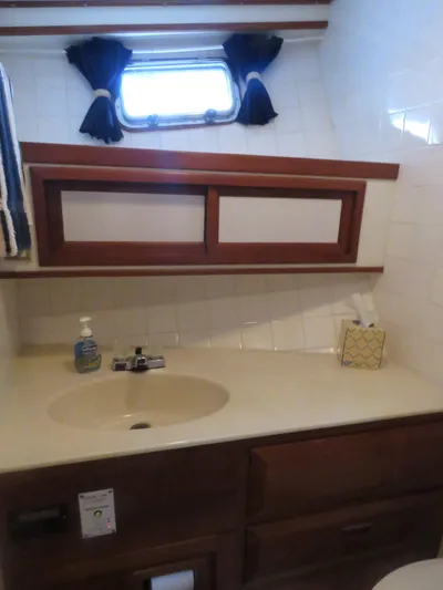 Patient Lady Yacht Photos Pics Bathroom in 1987 DeFever 49 Pilothouse with sink and window.