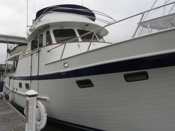Patient Lady Yacht Photos Pics 1987 DeFever 49 Pilothouse yacht docked.
