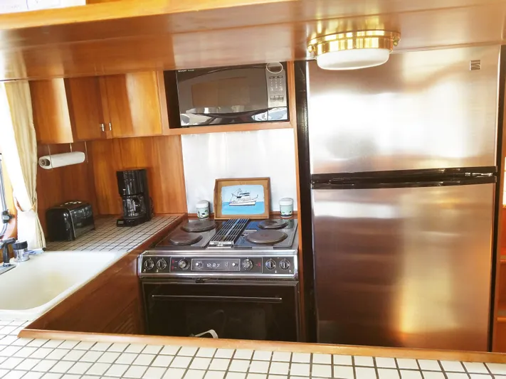Patient Lady Yacht Photos Pics 1987 DeFever 49 Pilothouse yacht kitchen interior.