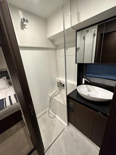  Yacht Photos Pics Modern bathroom in 2023 Prestige 460 Flybridge yacht with sleek fixtures and elegant design.