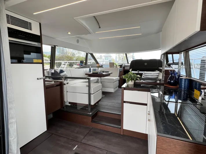  Yacht Photos Pics Luxurious interior of 2023 Prestige 460 Flybridge yacht with modern design and elegant furnishings.