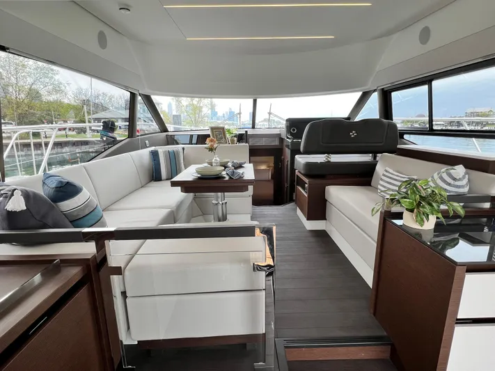  Yacht Photos Pics Luxurious interior of 2023 Prestige 460 Flybridge yacht with elegant seating and decor.