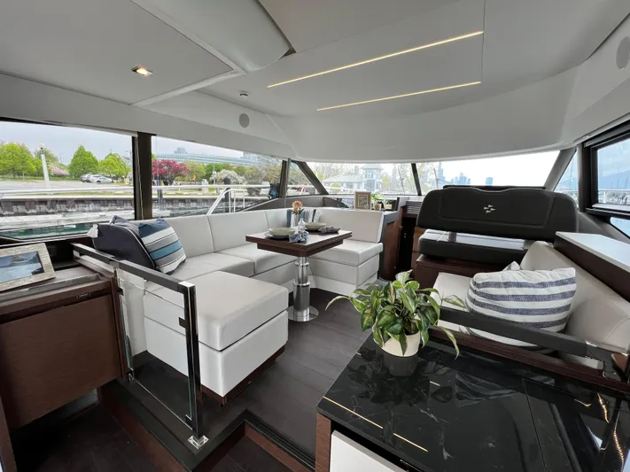  Yacht Photos Pics Luxurious interior of 2023 Prestige 460 Flybridge yacht with modern seating and decor.