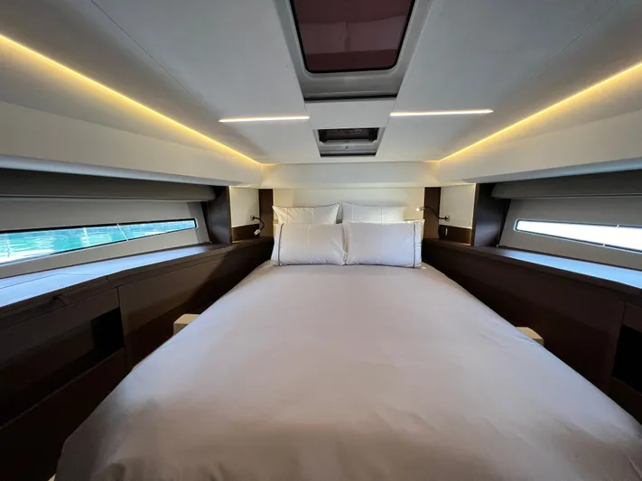  Yacht Photos Pics Luxurious bedroom interior of 2023 Prestige 460 Flybridge yacht with modern lighting.