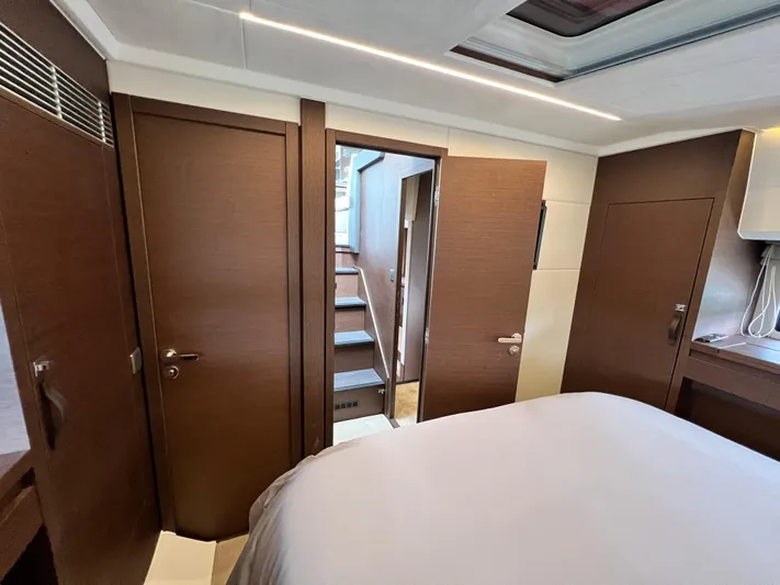 Yacht Photos Pics Luxurious interior of 2023 Prestige 460 Flybridge yacht cabin with modern wood finish.