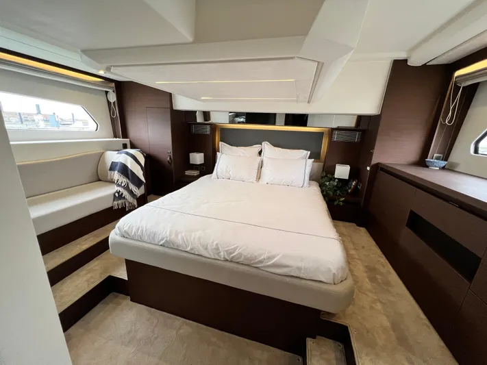  Yacht Photos Pics Luxurious bedroom interior of 2023 Prestige 460 Flybridge yacht with modern design.