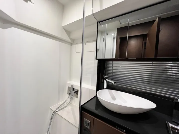  Yacht Photos Pics Modern bathroom in 2023 Prestige 460 Flybridge yacht with sleek sink and shower.