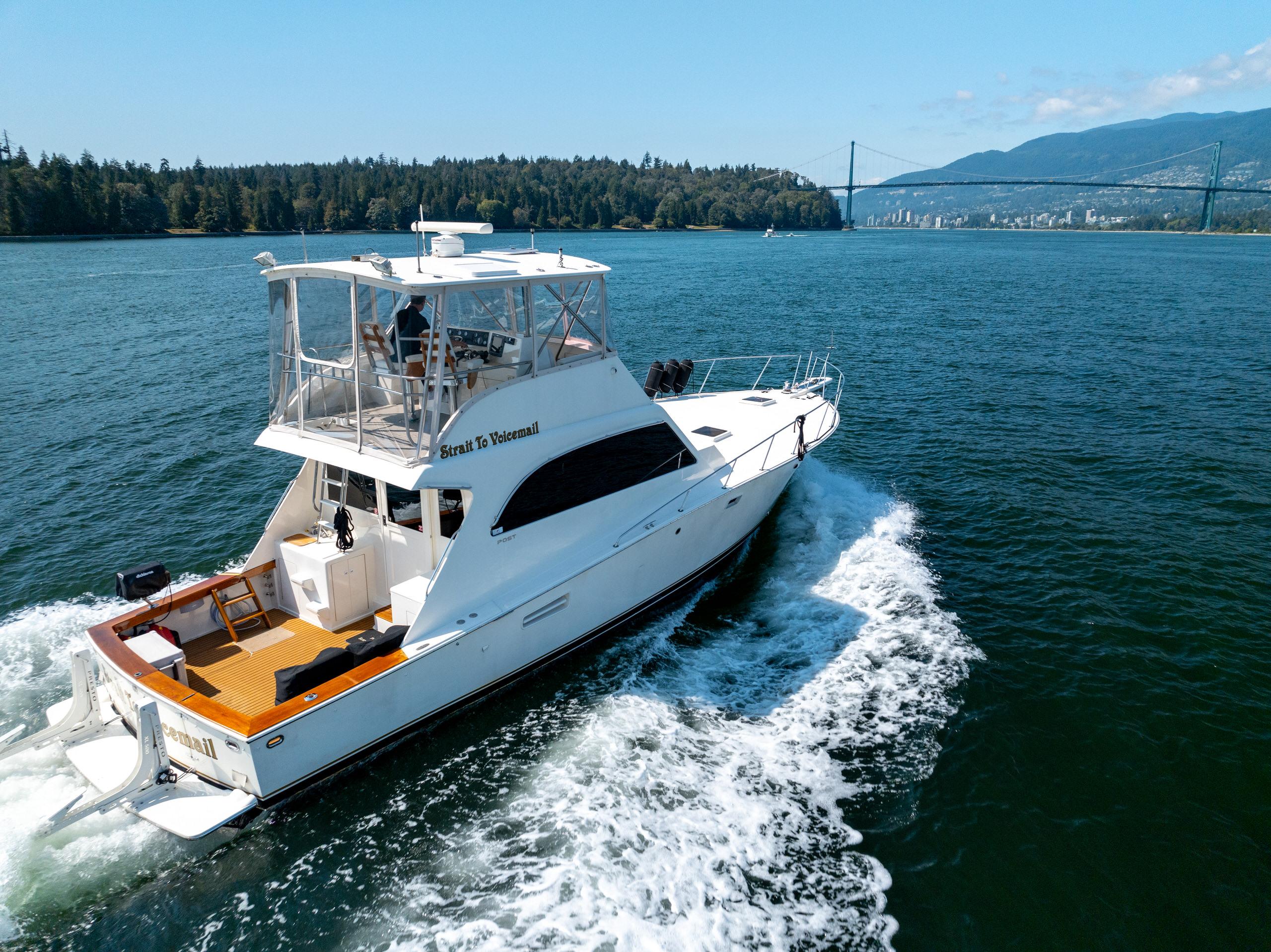 1985 Post 46 Convertible Yacht cruising on open water.