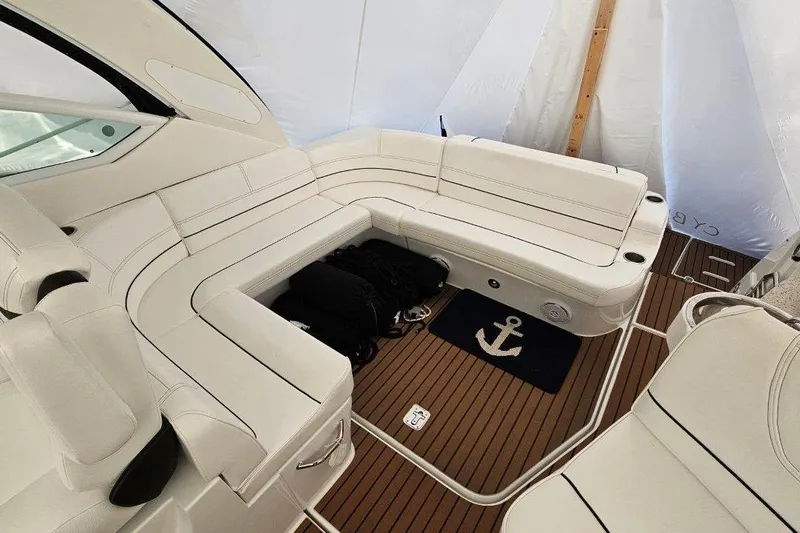  Yacht Photos Pics 2012 Cruisers Yachts 380 Express interior with white seating and wooden flooring.