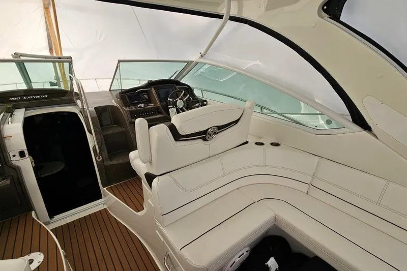  Yacht Photos Pics 2012 Cruisers Yachts 380 Express interior with white seating and modern helm.