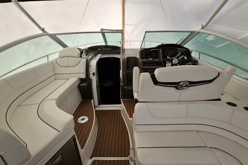  Yacht Photos Pics 2012 Cruisers Yachts 380 Express interior with white seating and wooden flooring.