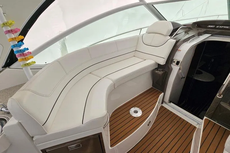  Yacht Photos Pics 2012 Cruisers Yachts 380 Express interior with white seating and wood flooring.