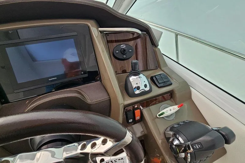  Yacht Photos Pics 2012 Cruisers Yachts 380 Express helm with Garmin display and controls.