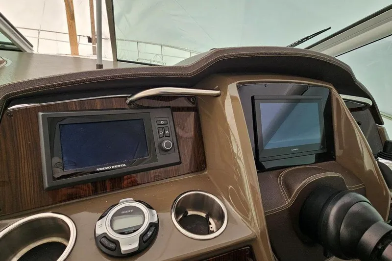  Yacht Photos Pics 2012 Cruisers Yachts 380 Express dashboard with navigation screens and controls.