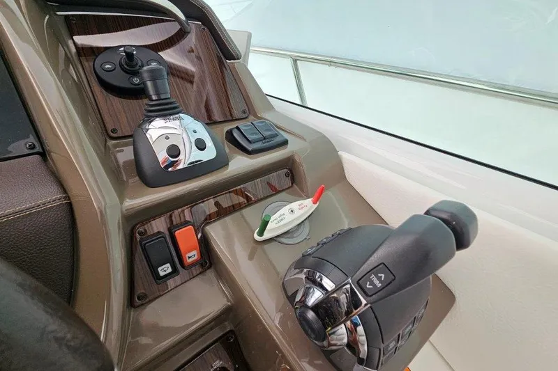  Yacht Photos Pics Control panel of 2012 Cruisers Yachts 380 Express with joystick and throttle.