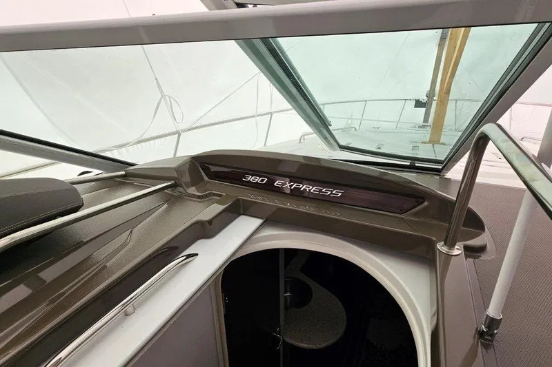  Yacht Photos Pics 2012 Cruisers Yachts 380 Express cockpit with open hatch and sleek design.