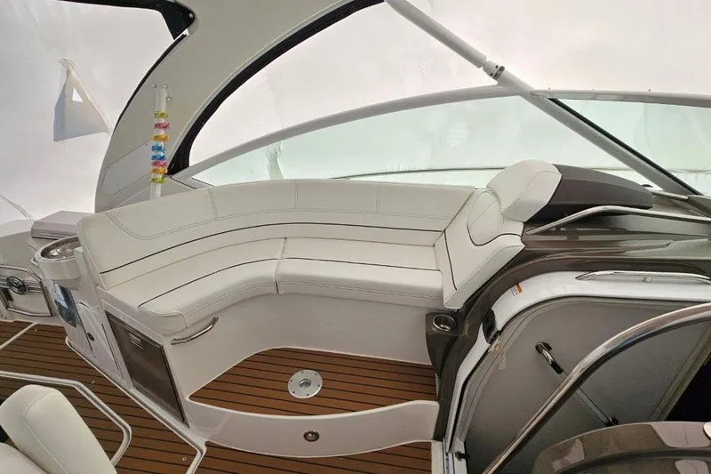  Yacht Photos Pics Luxurious interior of 2012 Cruisers Yachts 380 Express with white seating and wood flooring.