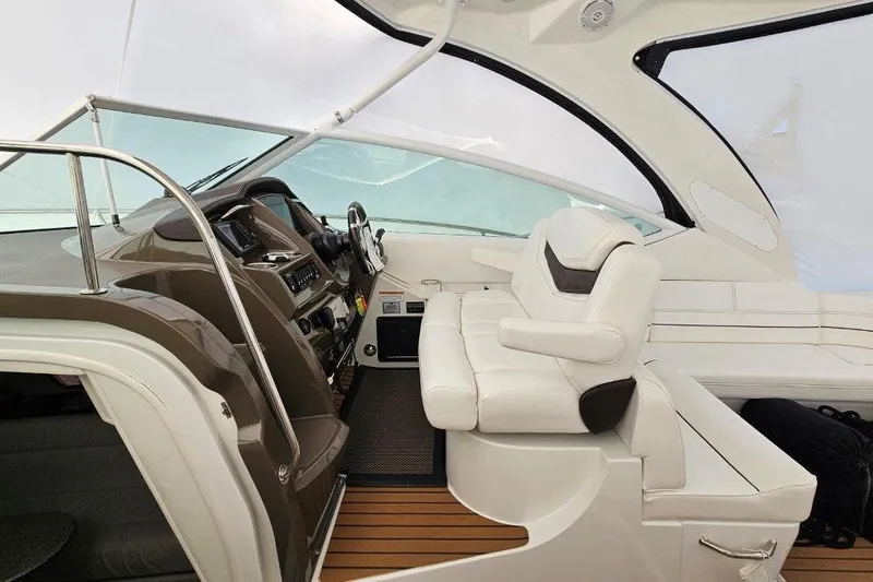  Yacht Photos Pics 2012 Cruisers Yachts 380 Express cockpit with white seating and modern dashboard.