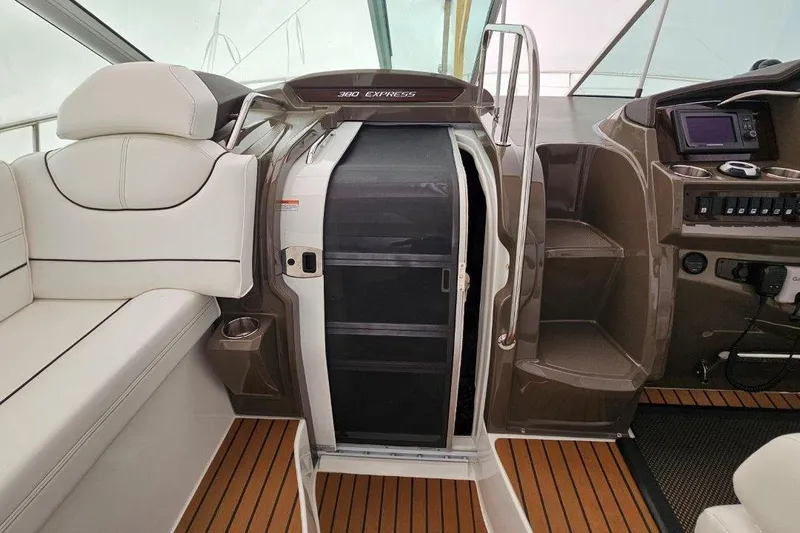  Yacht Photos Pics 2012 Cruisers Yachts 380 Express interior with seating and helm, featuring modern design elements.