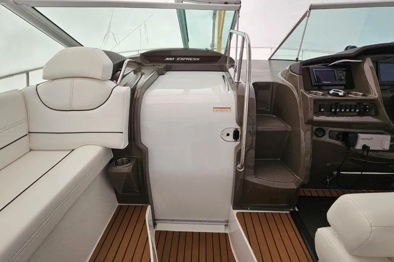  Yacht Photos Pics 2012 Cruisers Yachts 380 Express interior with white seating and modern dashboard.